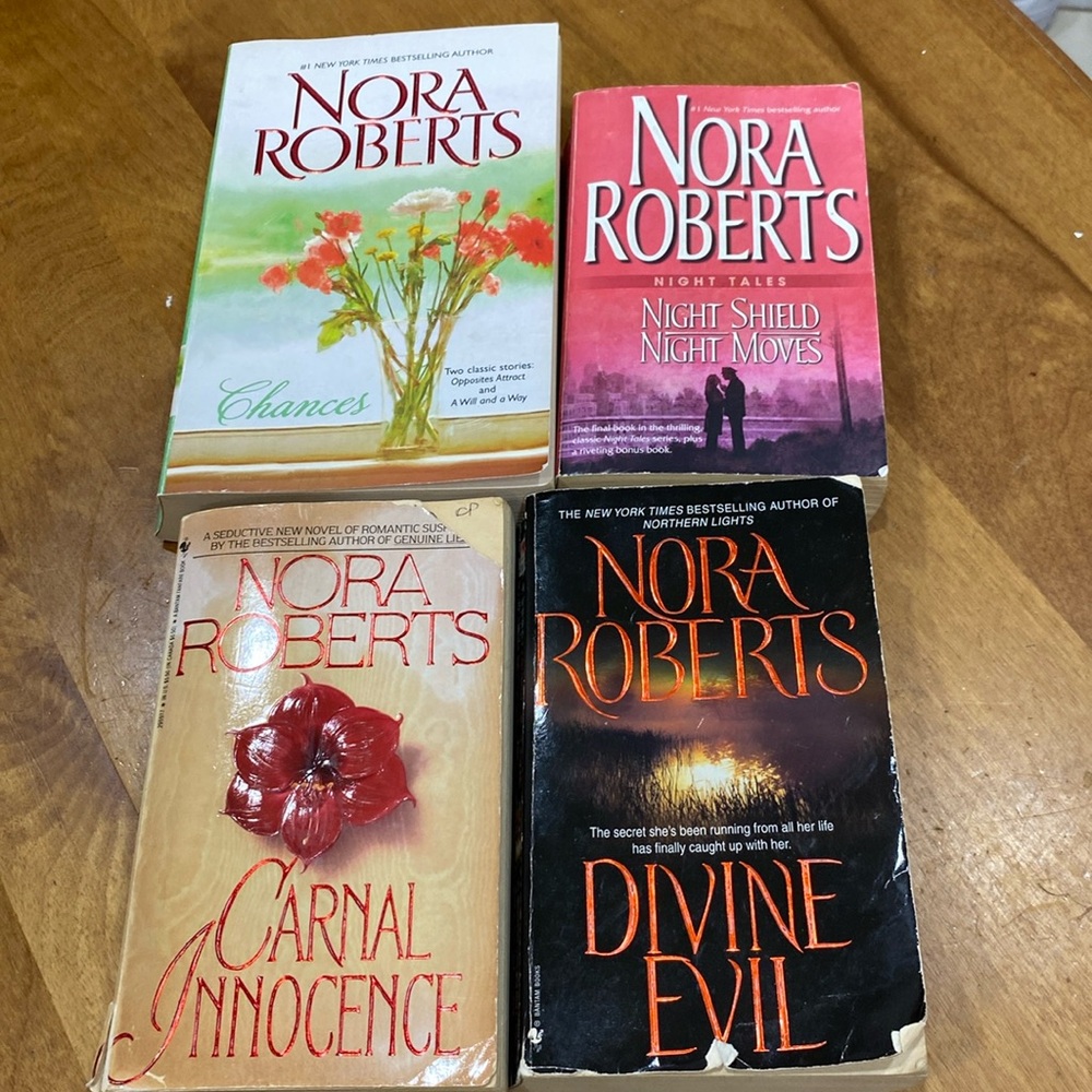 Set of 4, Nora Robert’s, used paperback books.